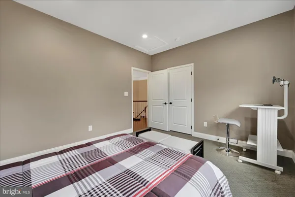 a bedroom with a bed and a table in it