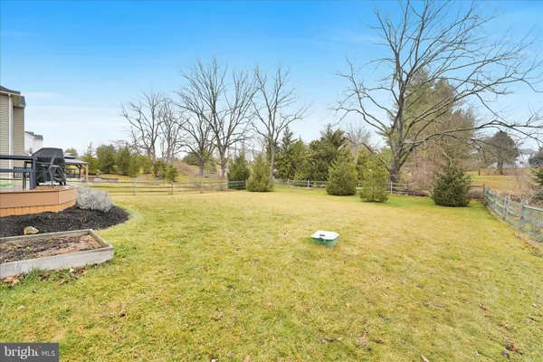 a view of yard with swimming pool and trees