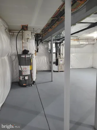 a utility room with multiple dryer and washer