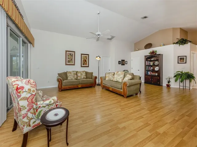 a kitchen with stainless steel appliances kitchen island granite countertop a sink and cabinets