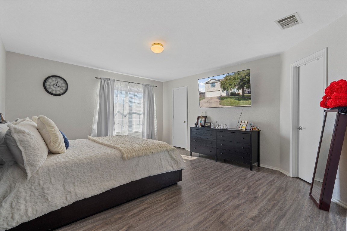 202 Rinehardt Street Hutto, TX 78634 - Photo 18 of 31 a bed room with a bed and a window