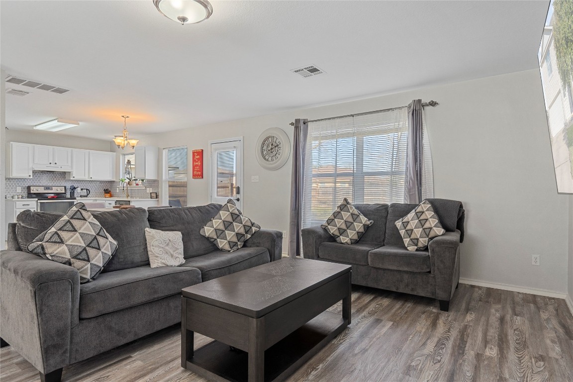 202 Rinehardt Street Hutto, TX 78634 - Photo 2 of 31 a living room with furniture and a large window