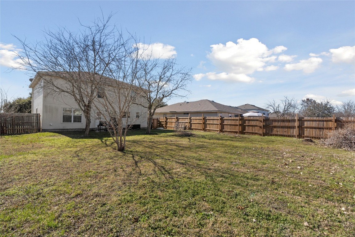 202 Rinehardt Street Hutto, TX 78634 - Photo 28 of 31 a front view of a house with a yard