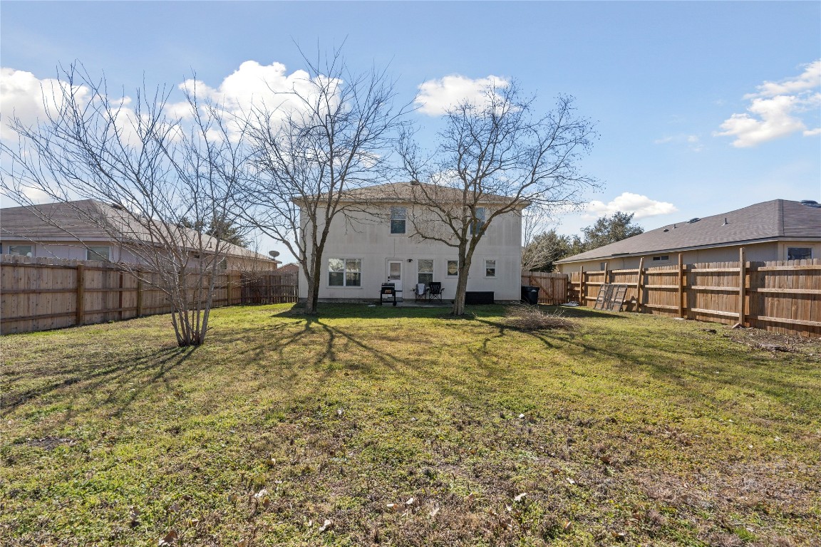 202 Rinehardt Street Hutto, TX 78634 - Photo 30 of 31 a view of a house with a yard
