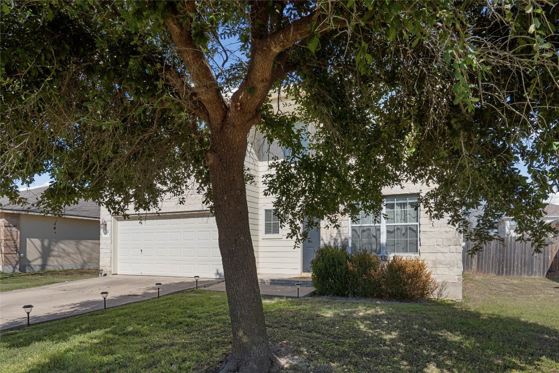 202 Rinehardt Street Hutto, TX 78634 - Photo 5 of 31 a view of a backyard