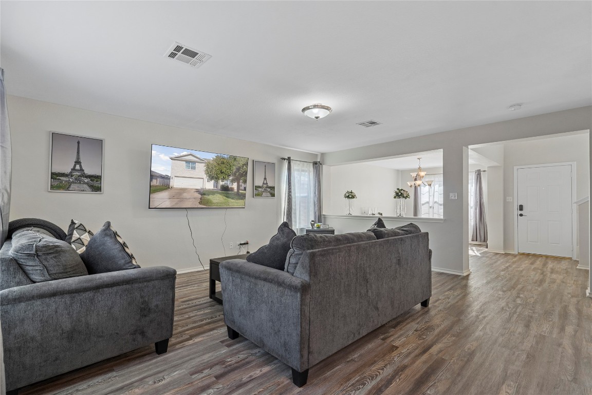 202 Rinehardt Street Hutto, TX 78634 - Photo 10 of 31 a living room with furniture and a wooden floor