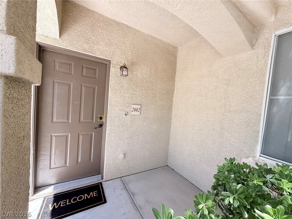 9050 West Warm Springs Road, Unit 2002 Las Vegas, NV 89148 - Photo 2 of 46 The inviting entrance features a warm welcome, promising comfort and charm.