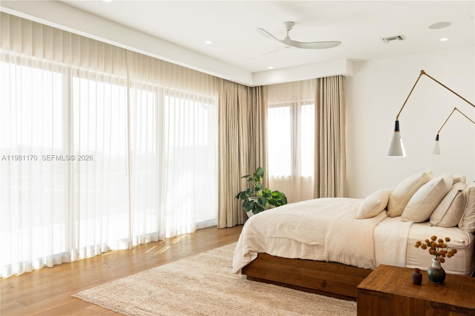 2300 Northeast 34th Court Lighthouse Point, FL 33064 - Photo 22 of 50 a bedroom with a bed and a window