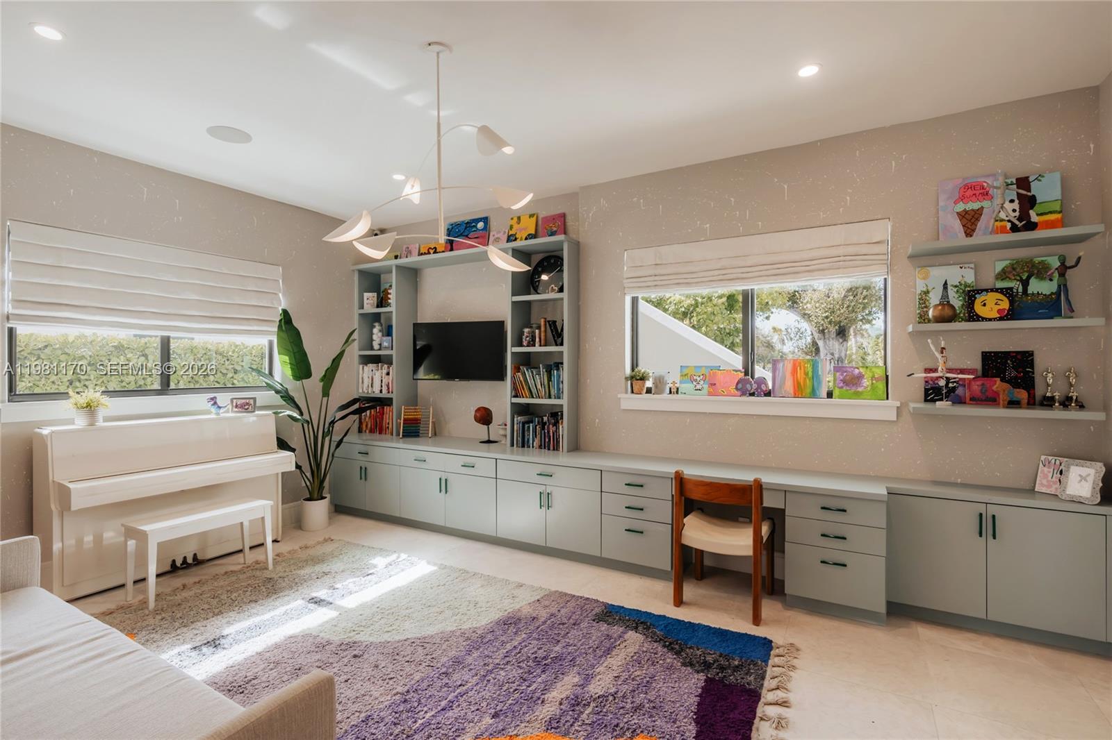 2300 Northeast 34th Court Lighthouse Point, FL 33064 - Photo 31 of 50 a kitchen that has a lot of cabinets a sink and a stove