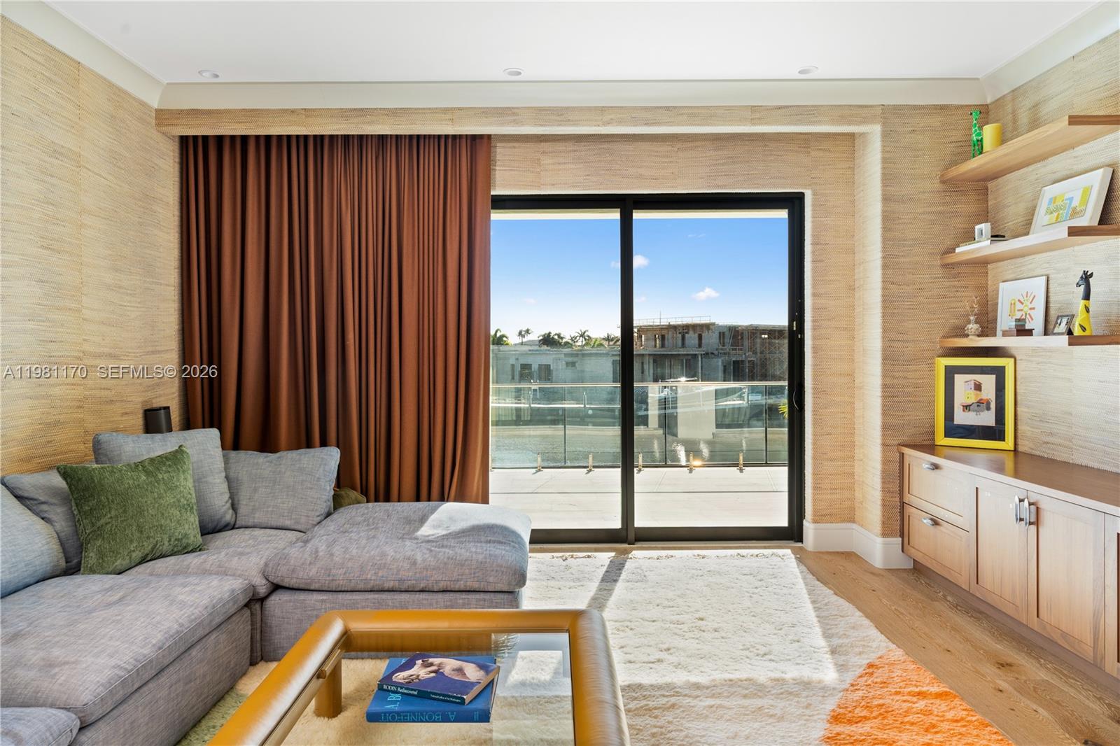 2300 Northeast 34th Court Lighthouse Point, FL 33064 - Photo 37 of 50 a living room with furniture and a fireplace