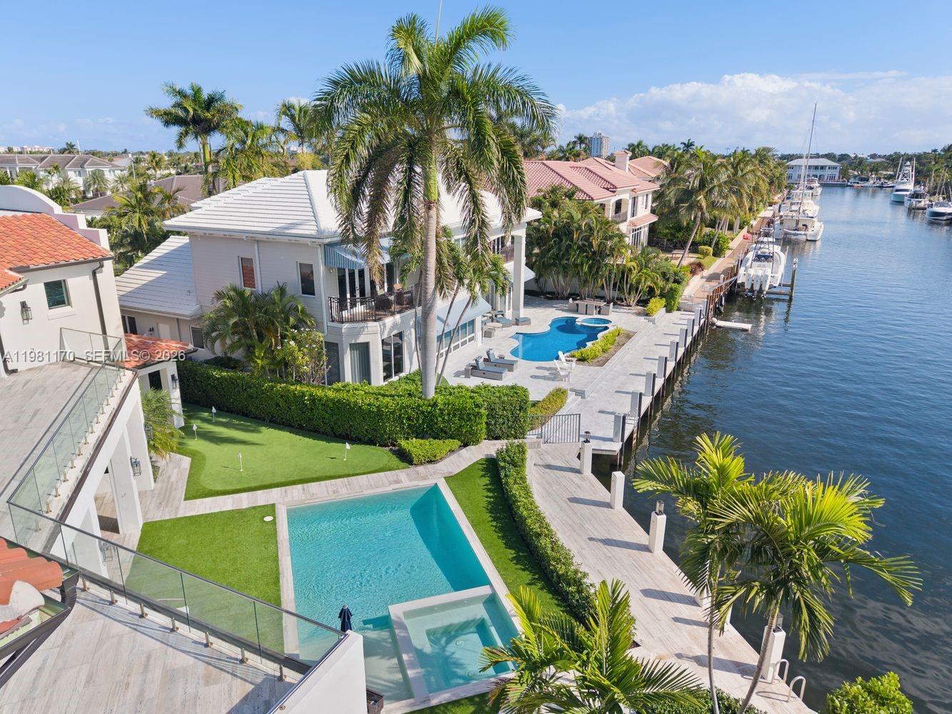 2300 Northeast 34th Court Lighthouse Point, FL 33064 - Photo 42 of 50 a view of a house with outdoor space and sitting area