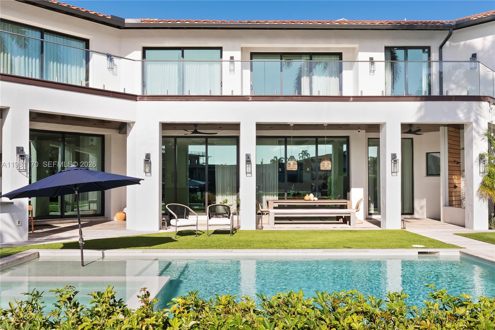 2300 Northeast 34th Court Lighthouse Point, FL 33064 - Photo 45 of 50 front view of a house with a patio