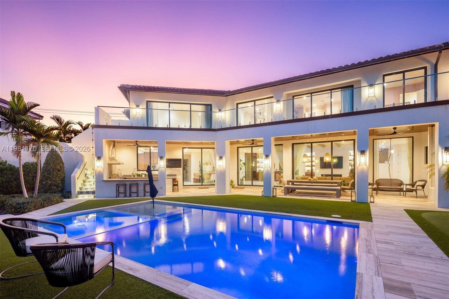 2300 Northeast 34th Court Lighthouse Point, FL 33064 - Photo 47 of 50 a view of a house with swimming pool and sitting area