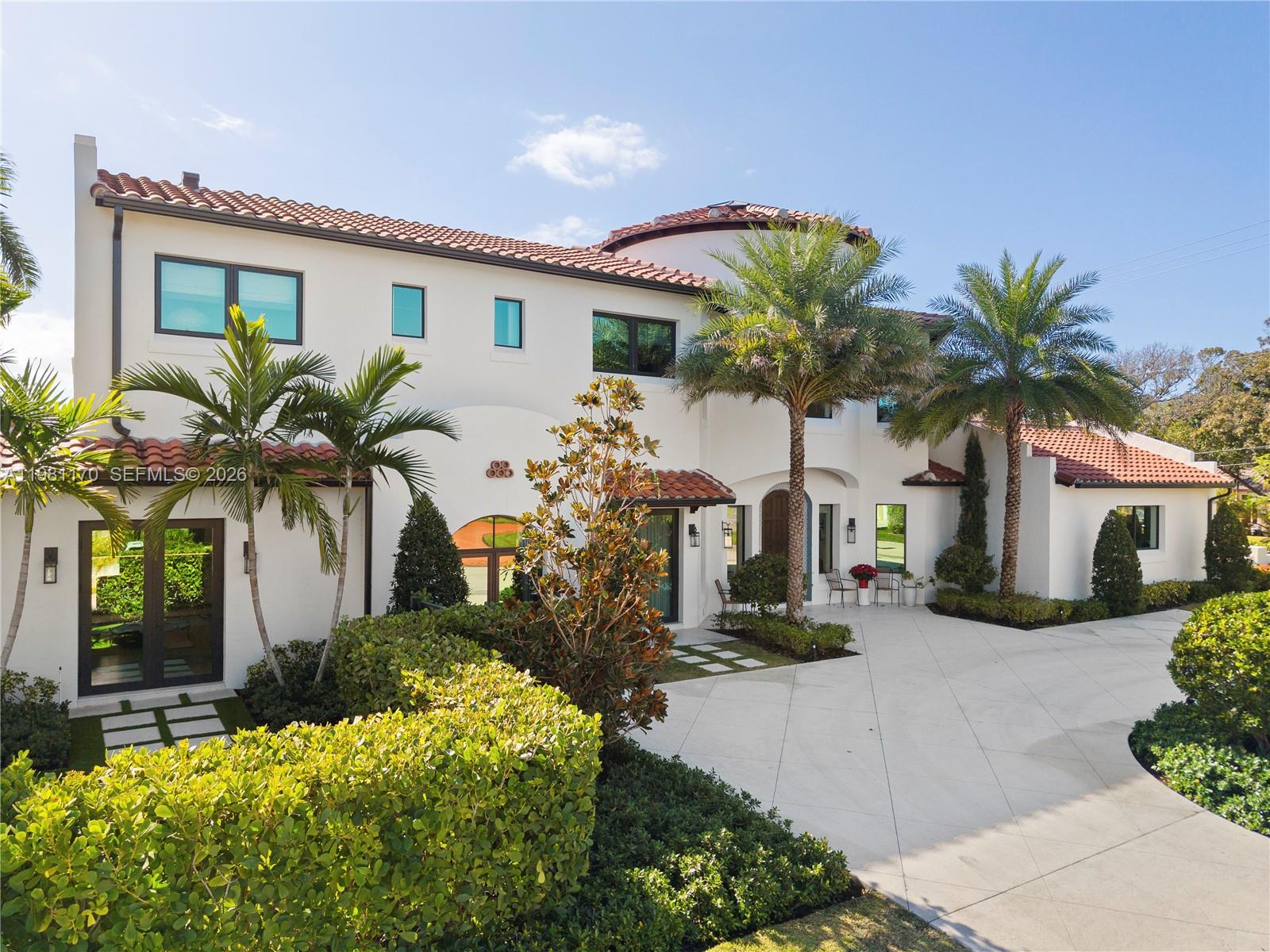 2300 Northeast 34th Court Lighthouse Point, FL 33064 - Photo 50 of 50 a front view of a house with a yard