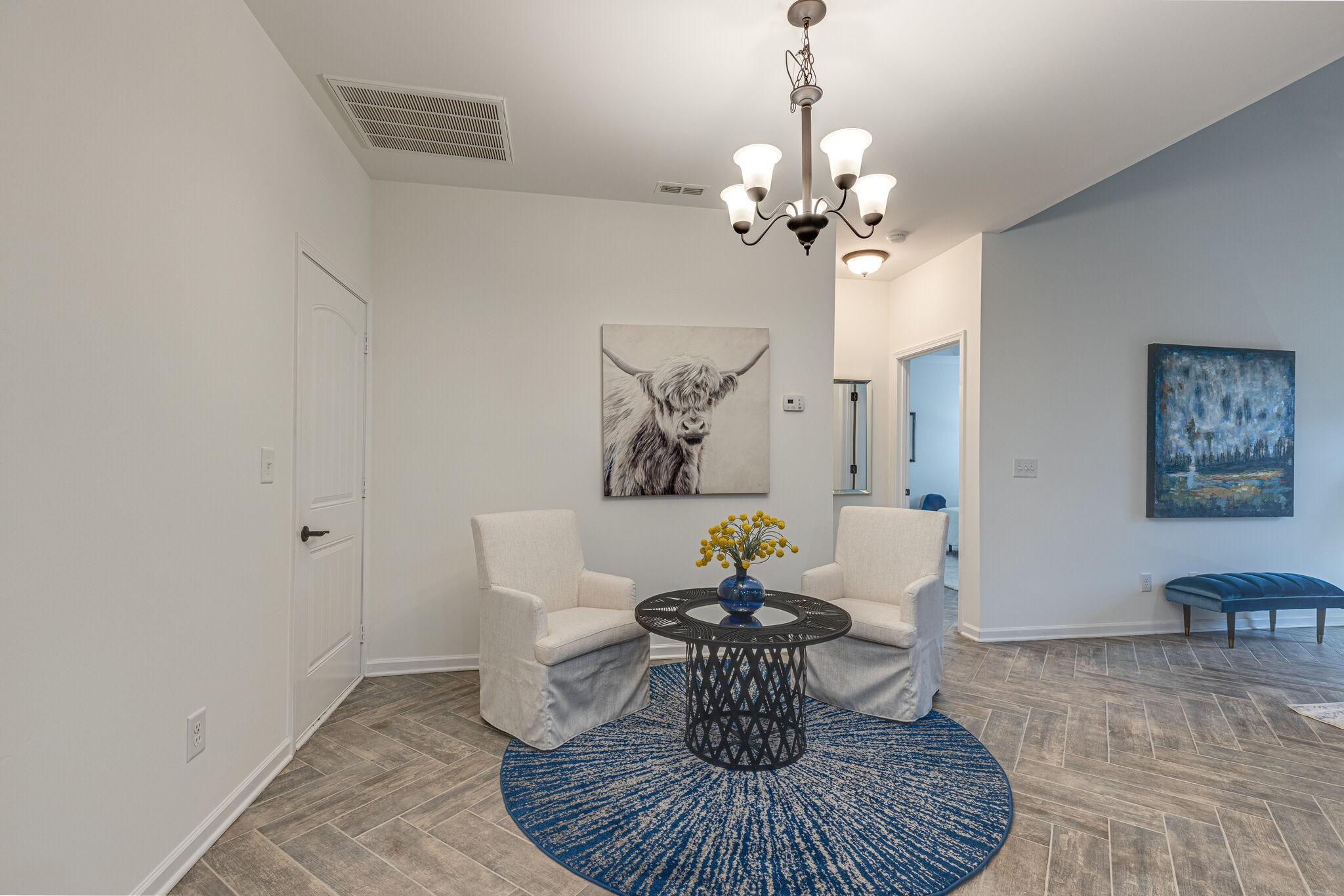1005 Kyle Road Spring Hill, TN 37174 - Photo 8 of 29 a dining room with furniture a chandelier and wooden floor