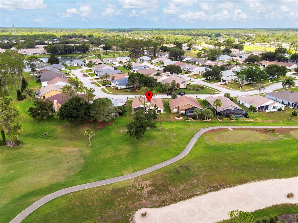 11228 Windrush Circle Hudson, FL 34667 - Photo 48 of 67 an aerial view of residential houses with outdoor space and swimming pool