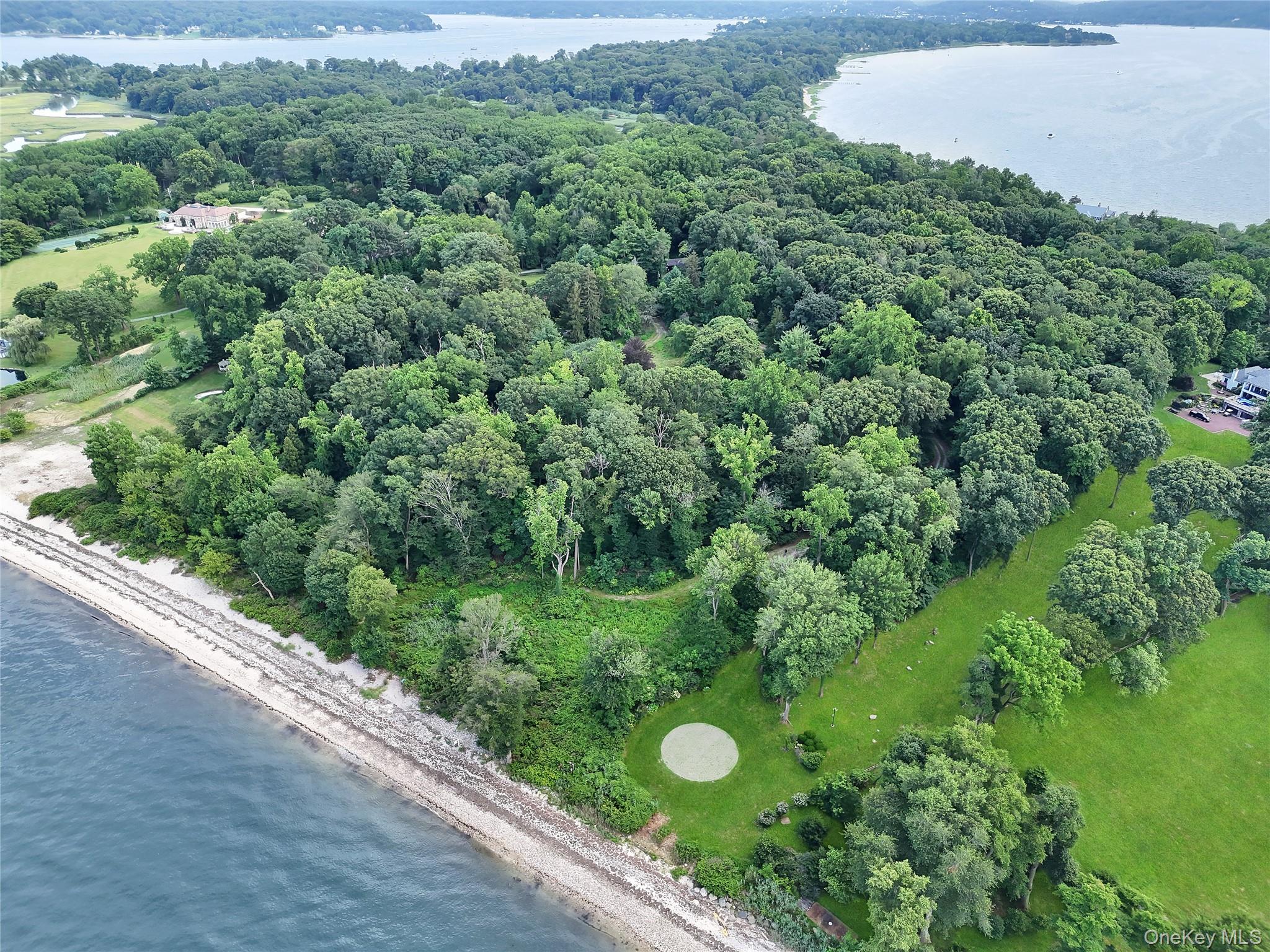 144 Centre Island Road Centre Island, NY 11771 - Photo 9 of 12 an aerial view of a forest with houses
