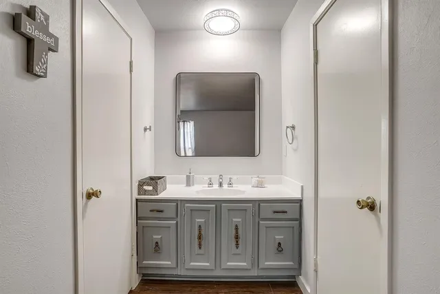 a bathroom with a sink and a mirror
