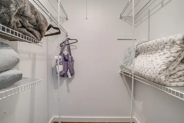 a bathroom with a shower and a sink
