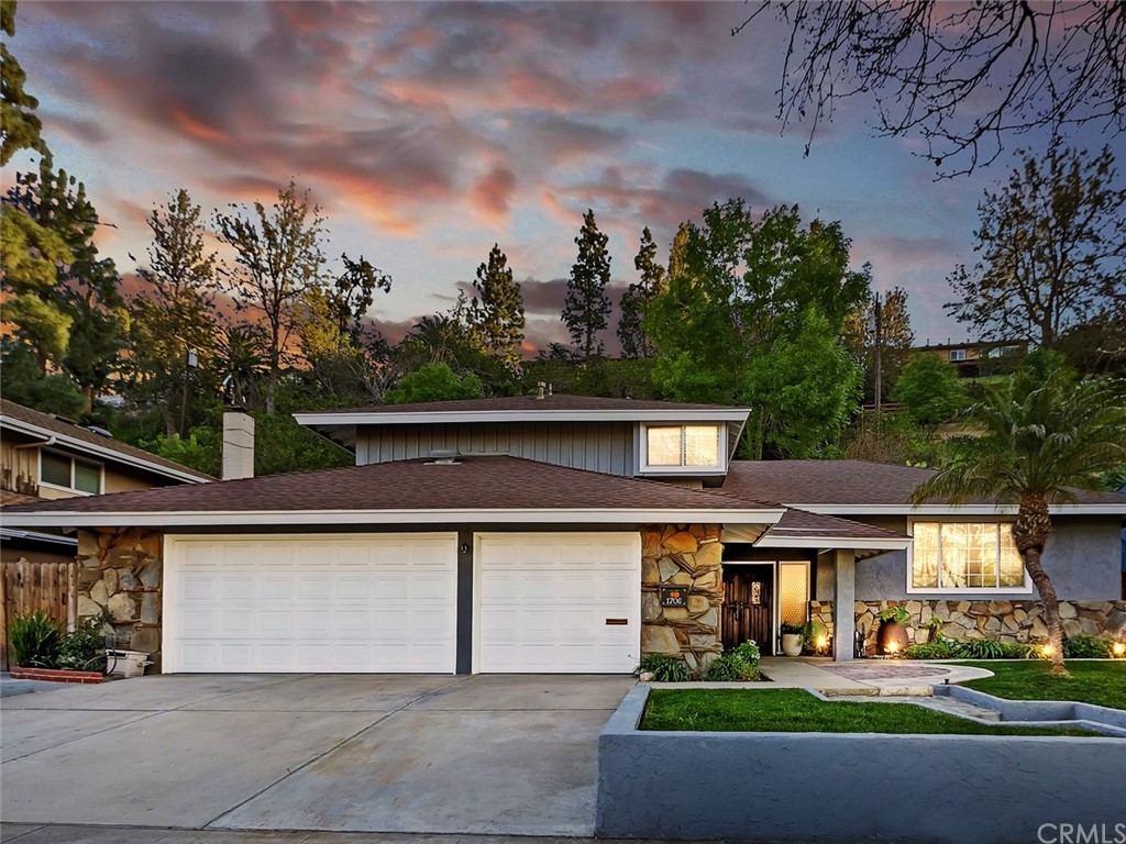 1706 East Santa Ana Canyon Road Orange, CA 92865 - Photo 1 of 1 a front view of a house with garden