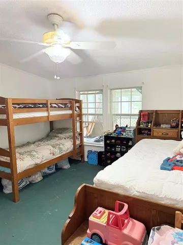a bedroom with furniture and a chandelier