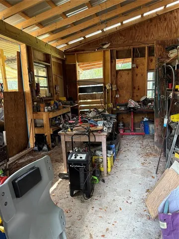 a room with lots of furniture and clutter