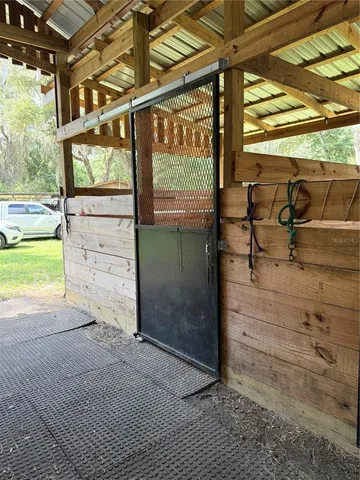 a view of a porch with wooden floor
