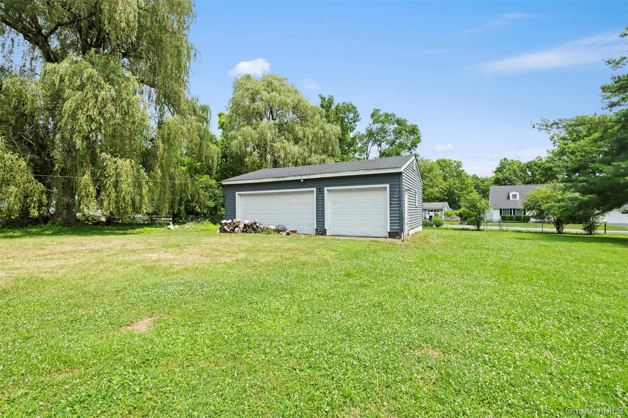 44 Woods Road Tivoli, NY 12583 - Photo 18 of 25 View of grassy yard featuring a garage and an outdoor structure