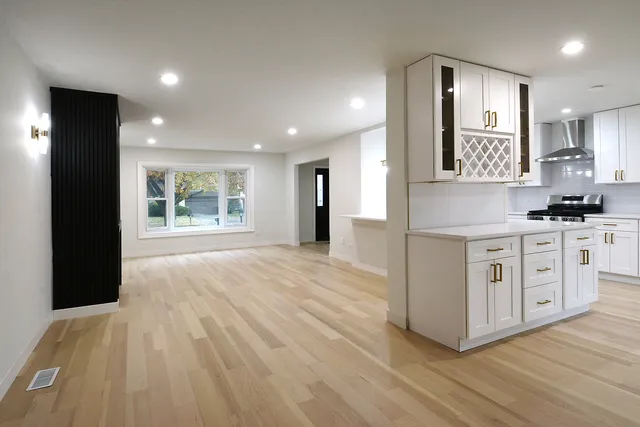 a view of a kitchen cabinets and wooden floor