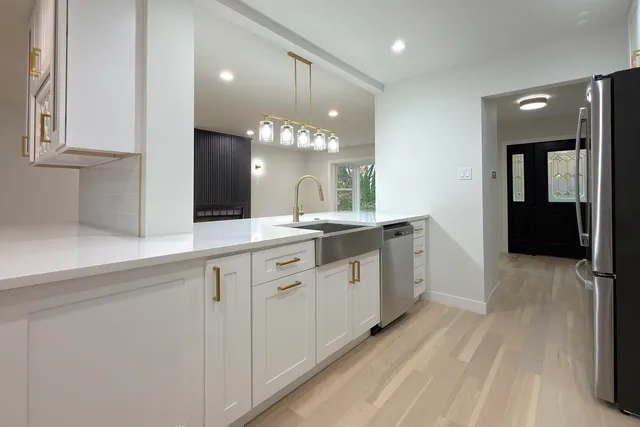 a spacious bathroom with a double vanity sink and a mirror