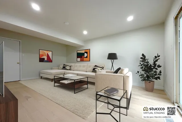 a living room with furniture and flowers