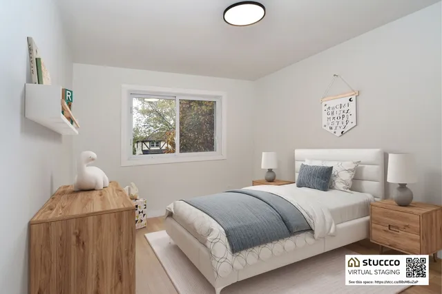 a bedroom with a bed and window