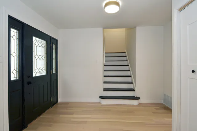 a view of entryway with stairs