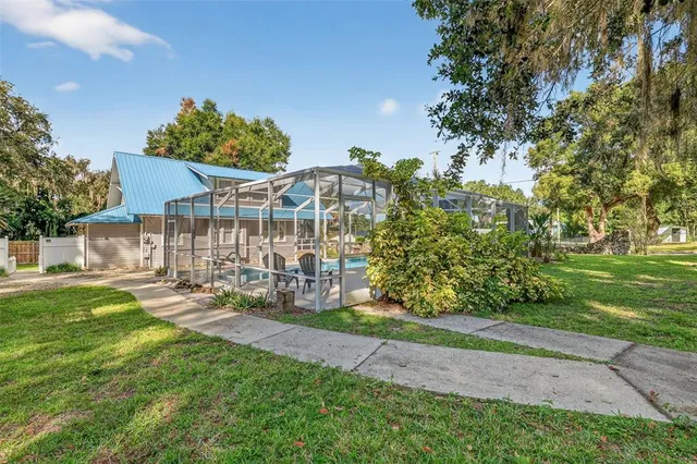 a view of a chair and tables in the garden