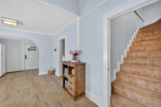 a view of entryway with wooden floor