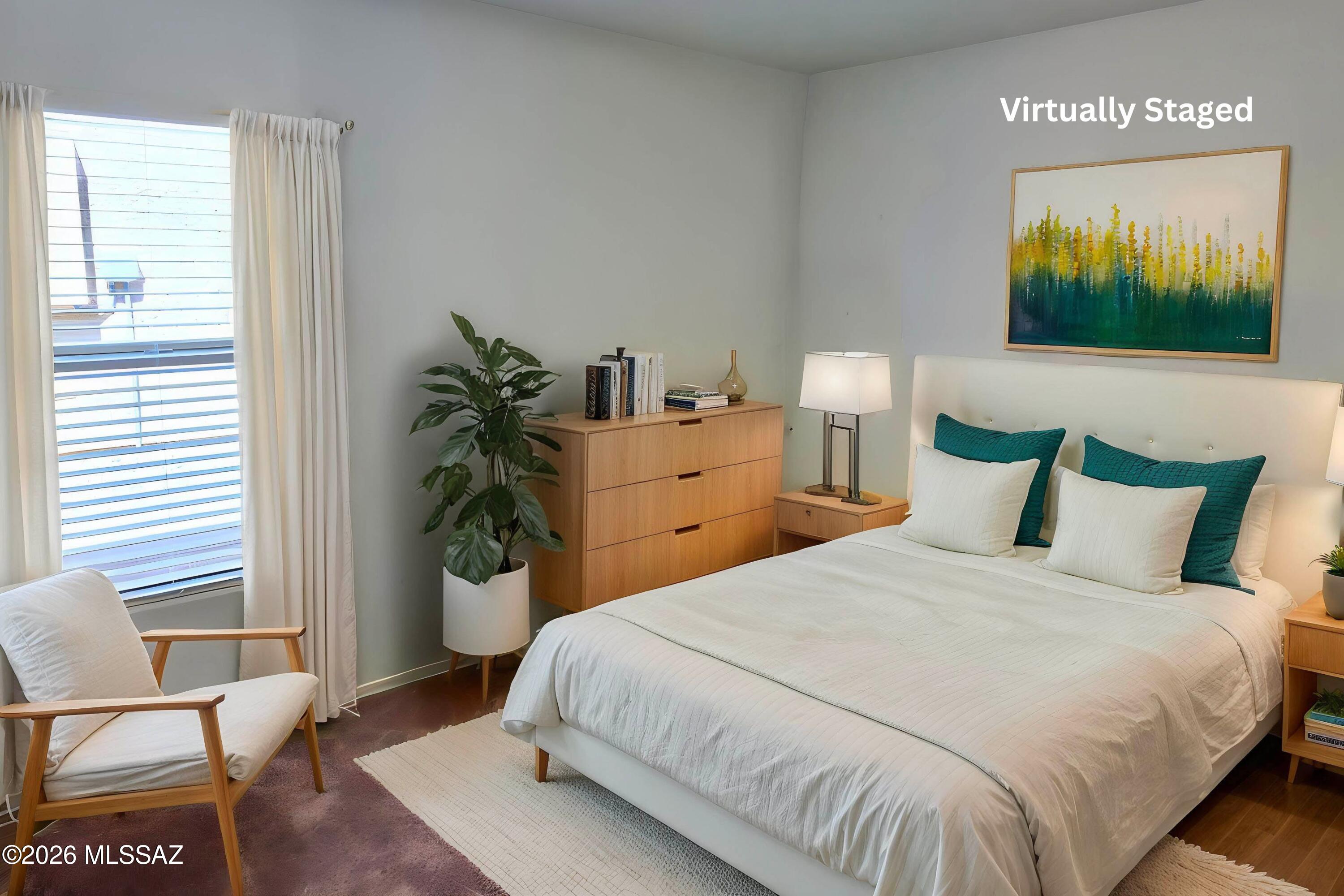 6343 South Rigby Way Tucson, AZ 85746 - Photo 15 of 29 a bedroom with a bed and a flat screen tv