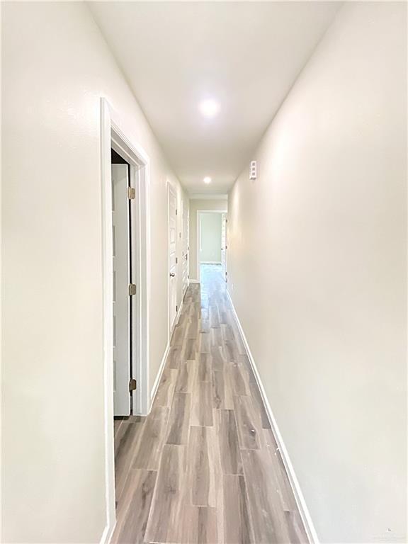 5048 McKenzie Road Brownsville, TX 78521 - Photo 3 of 11 a view of a hallway with wooden floor