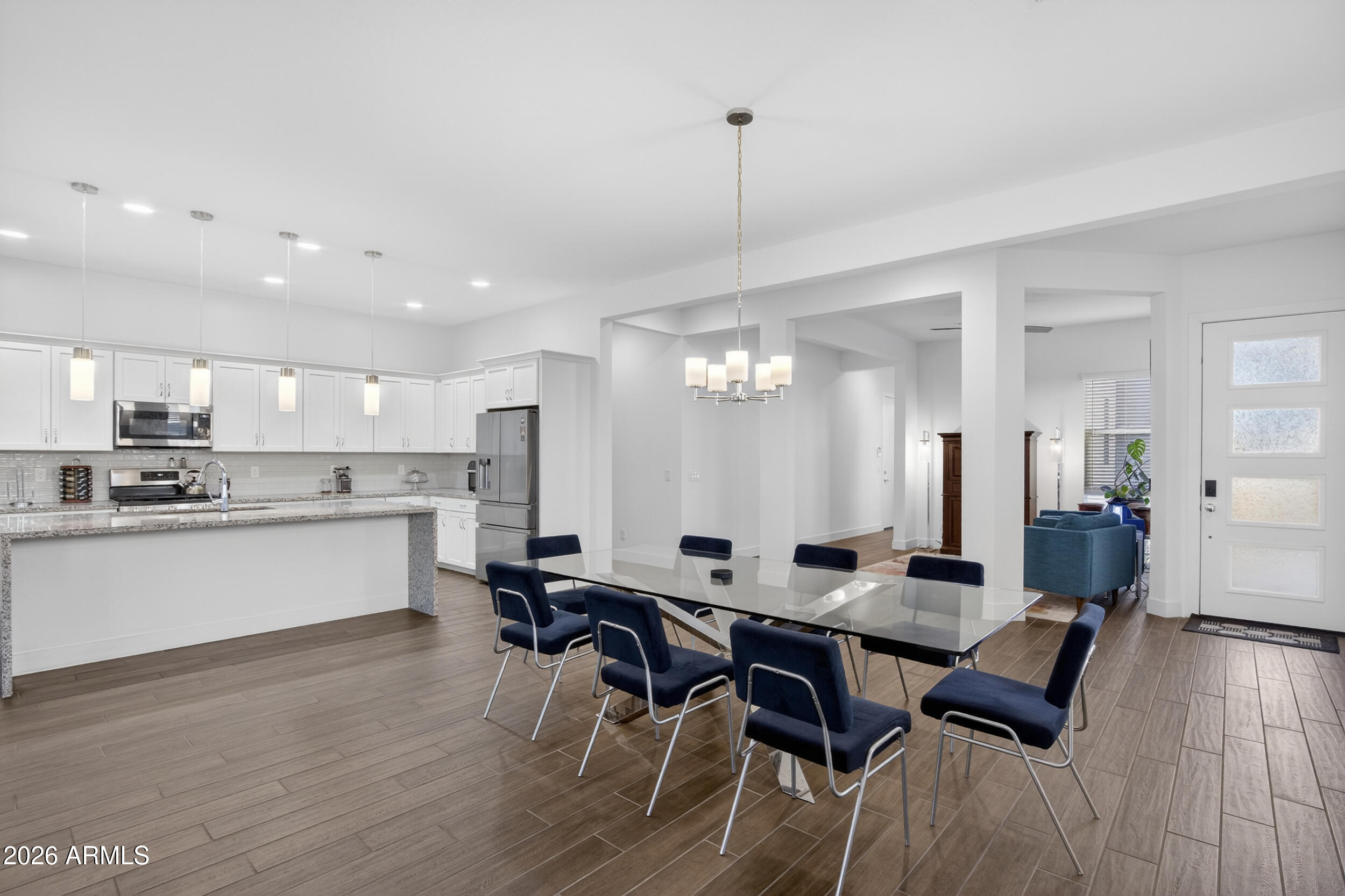 939 East Paseo Way Phoenix, AZ 85042 - Photo 10 of 78 a large kitchen with a table and chairs