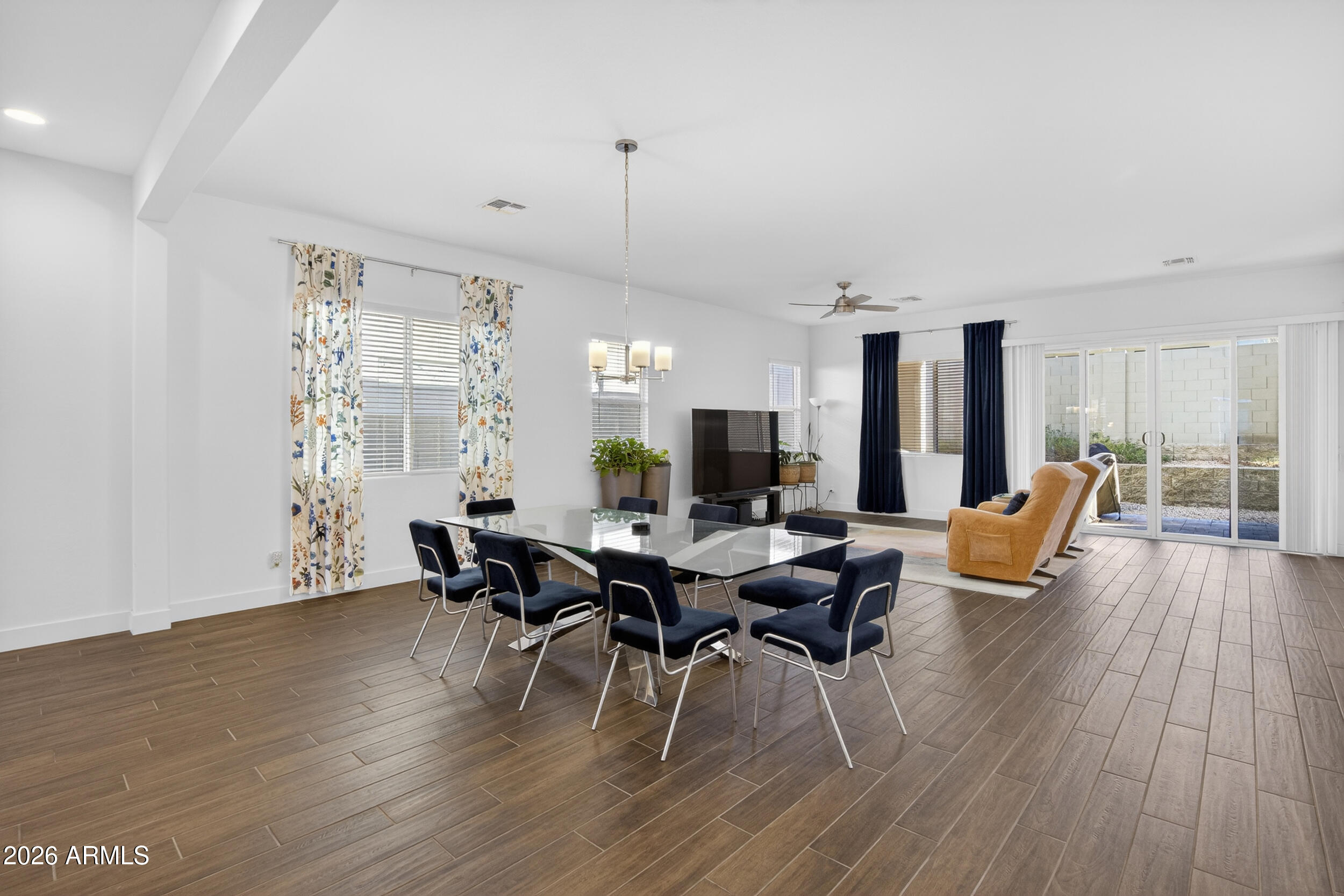 939 East Paseo Way Phoenix, AZ 85042 - Photo 13 of 78 a view of a dining room with furniture window and wooden floor