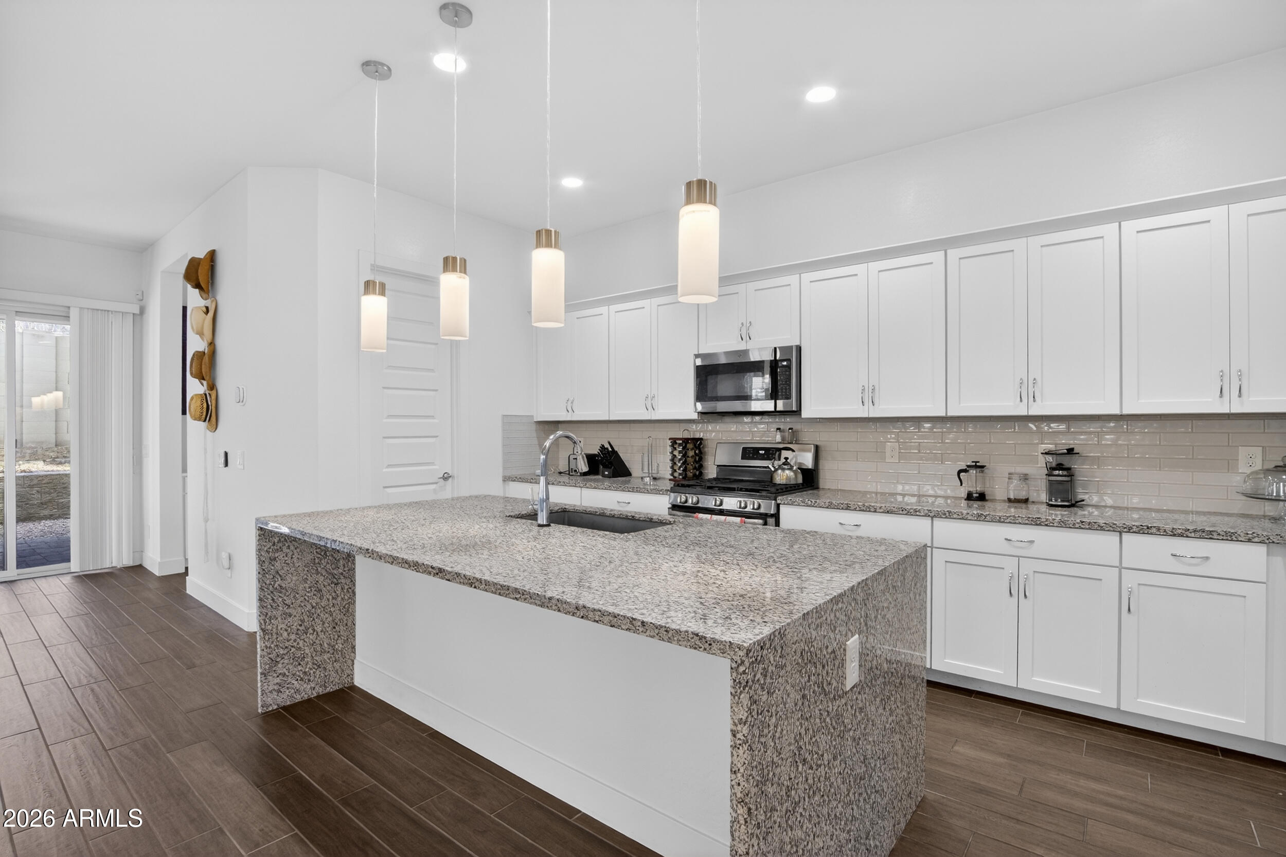 939 East Paseo Way Phoenix, AZ 85042 - Photo 14 of 78 a kitchen with appliances a sink and cabinets