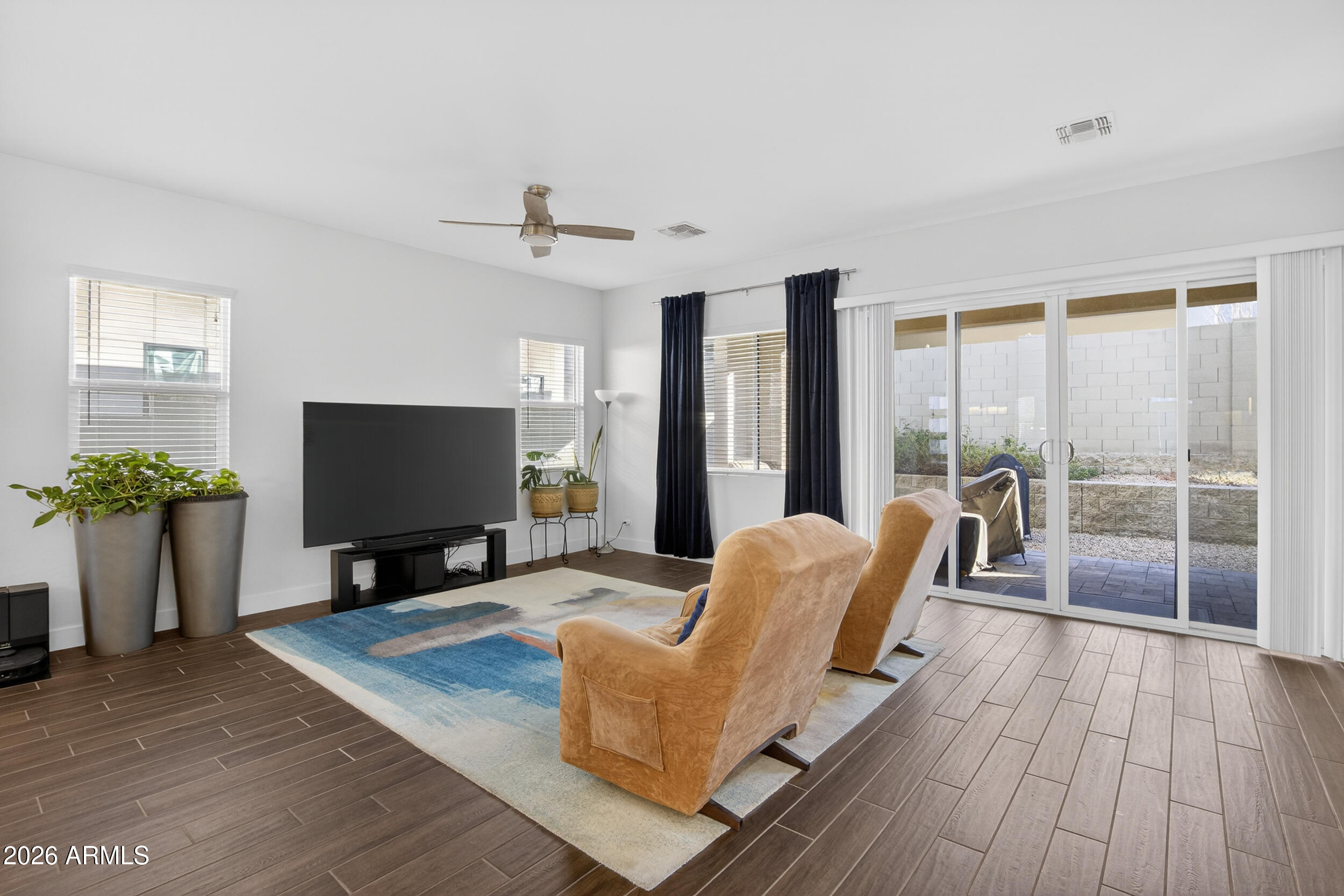 939 East Paseo Way Phoenix, AZ 85042 - Photo 21 of 78 a living room with furniture and a flat screen tv