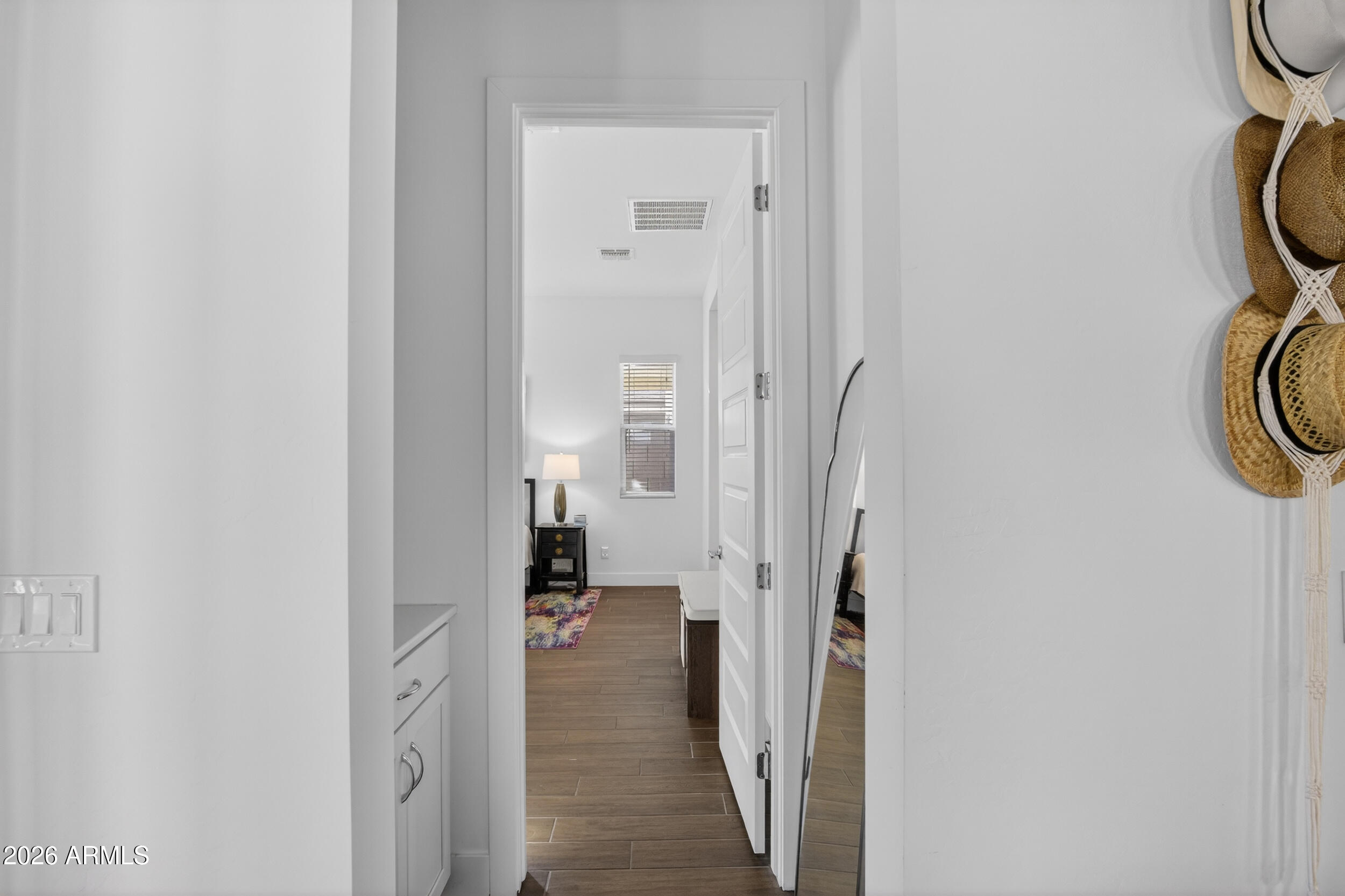 939 East Paseo Way Phoenix, AZ 85042 - Photo 24 of 78 a view of a bedroom from a hallway