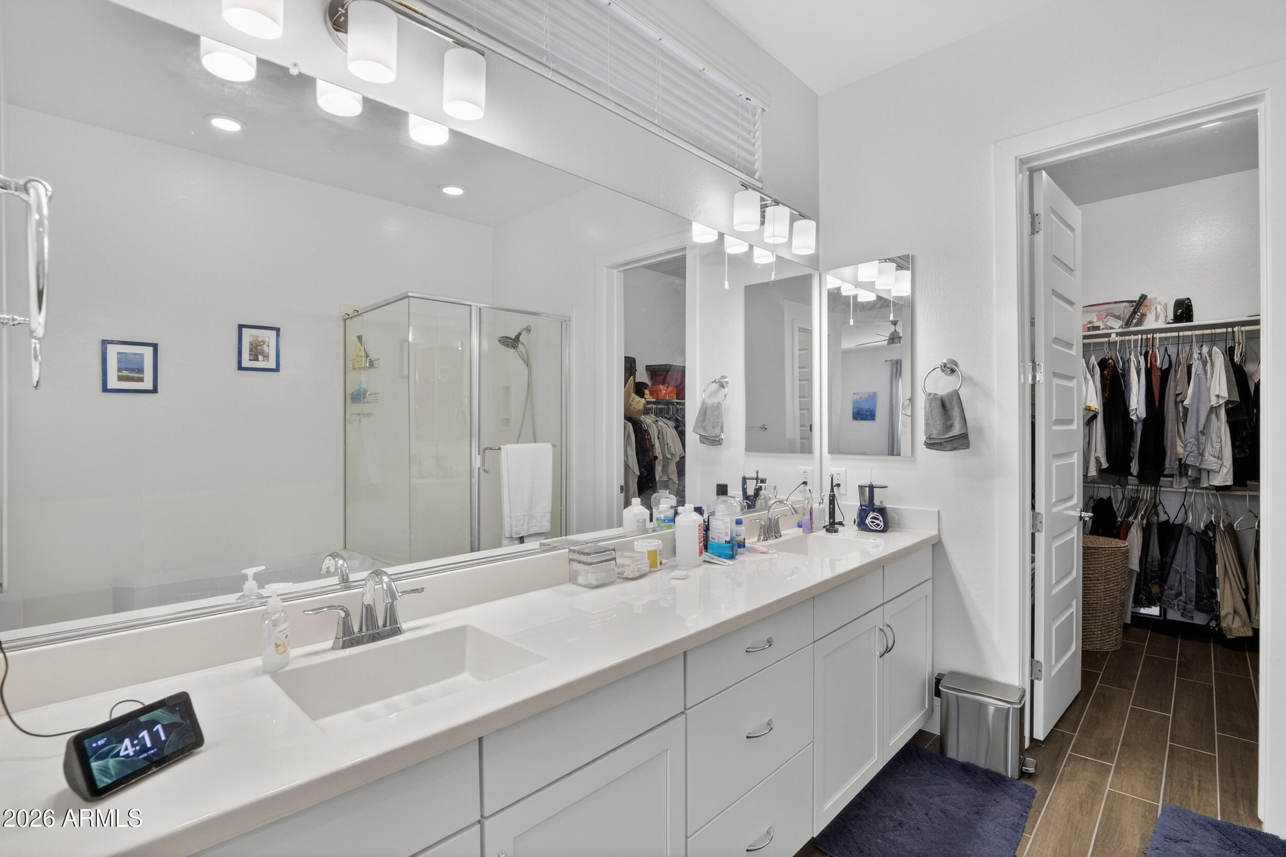 939 East Paseo Way Phoenix, AZ 85042 - Photo 28 of 78 a bathroom with double vanity sinks a vanity two mirror and shower