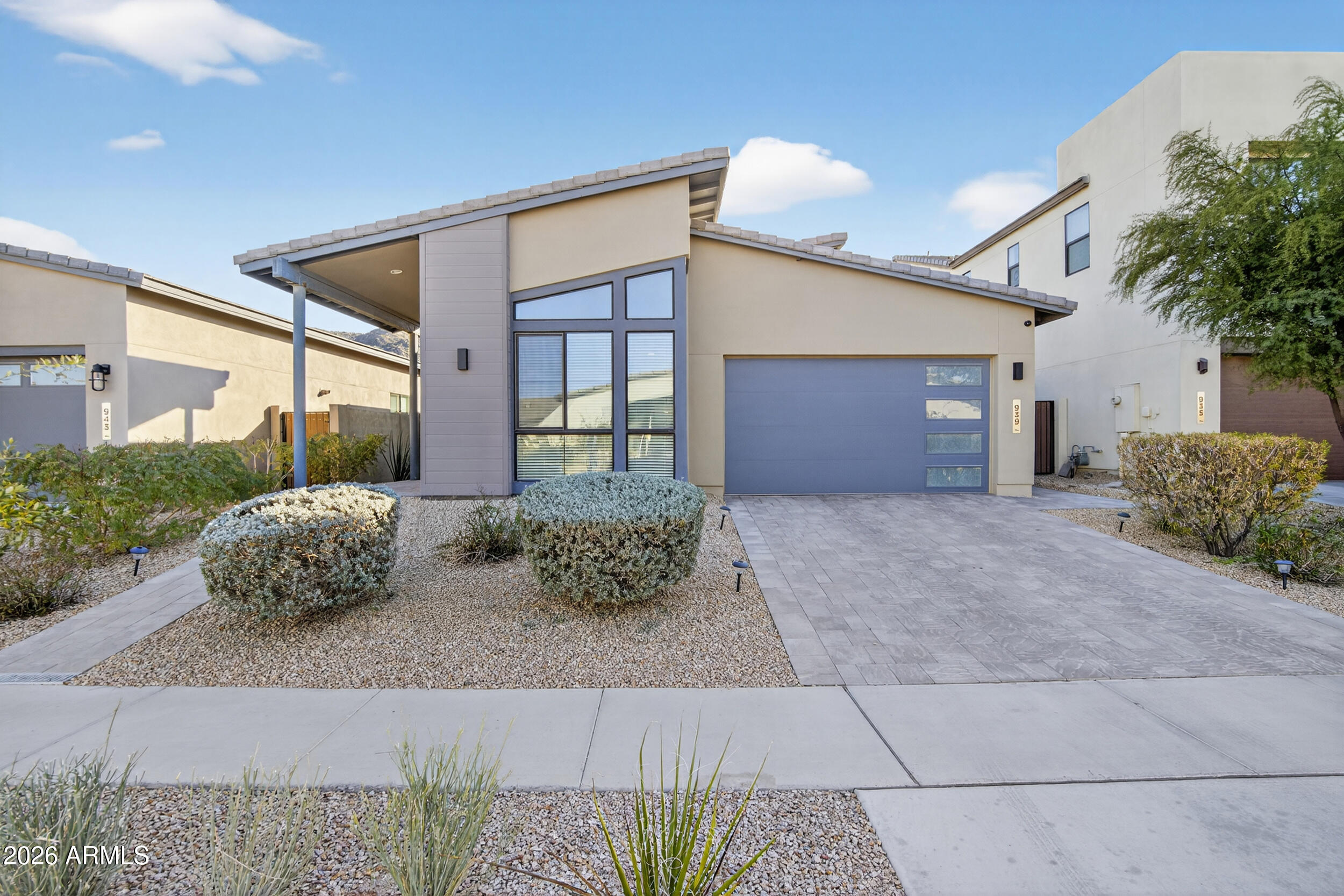939 East Paseo Way Phoenix, AZ 85042 - Photo 2 of 78 a front view of a house with garden