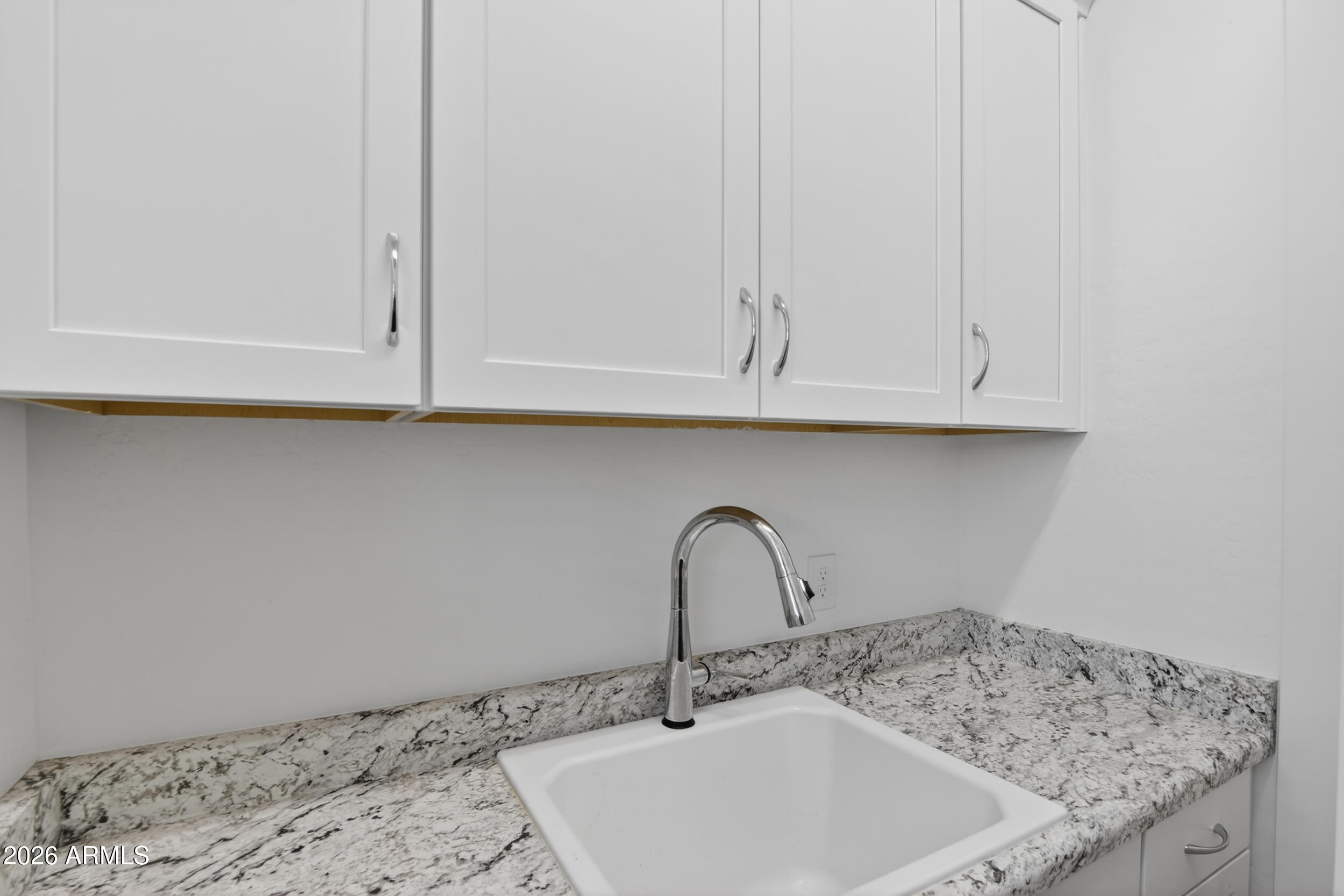 939 East Paseo Way Phoenix, AZ 85042 - Photo 48 of 78 a bathroom with a sink and cabinets