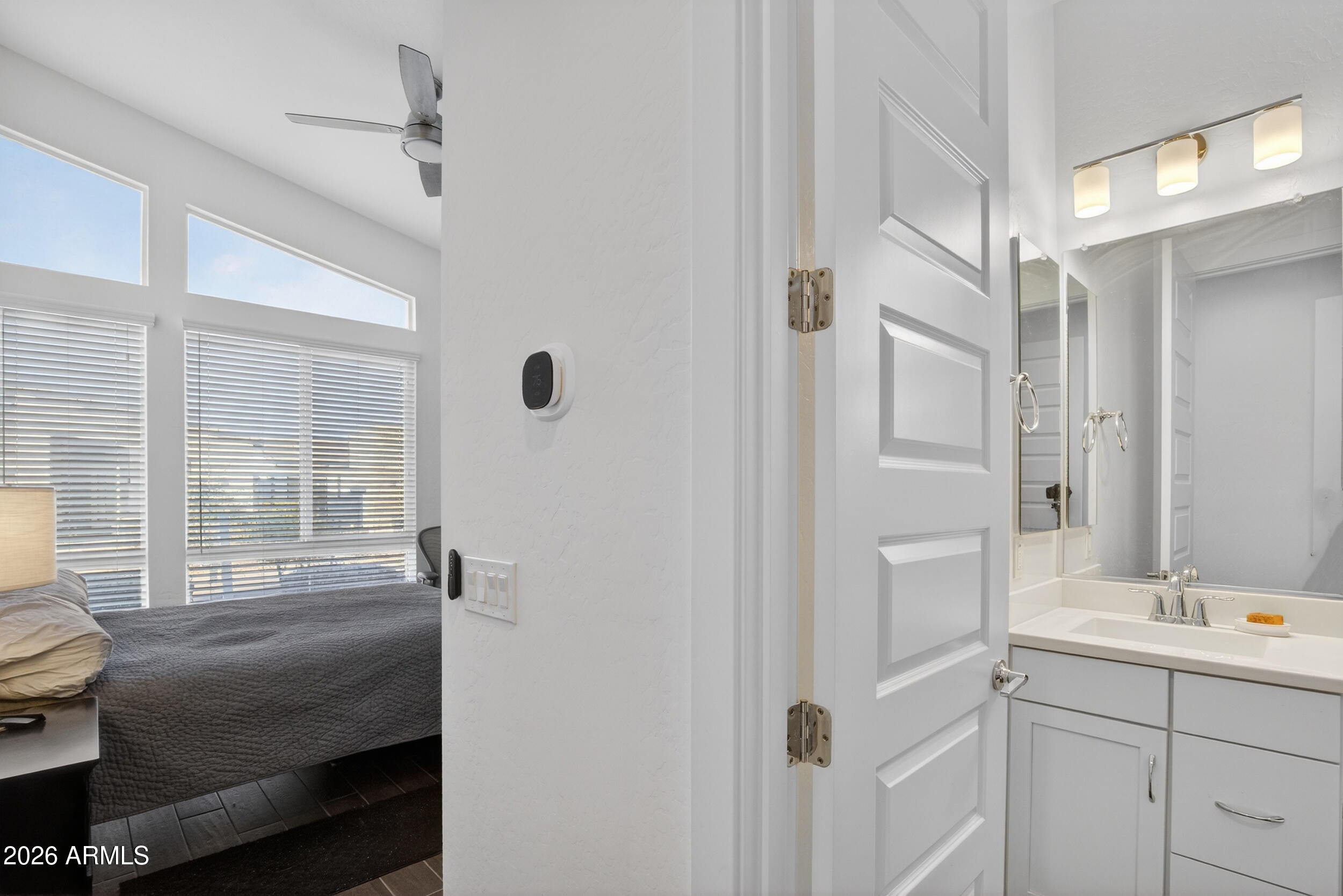 939 East Paseo Way Phoenix, AZ 85042 - Photo 49 of 78 a bathroom with a double vanity sink and mirror