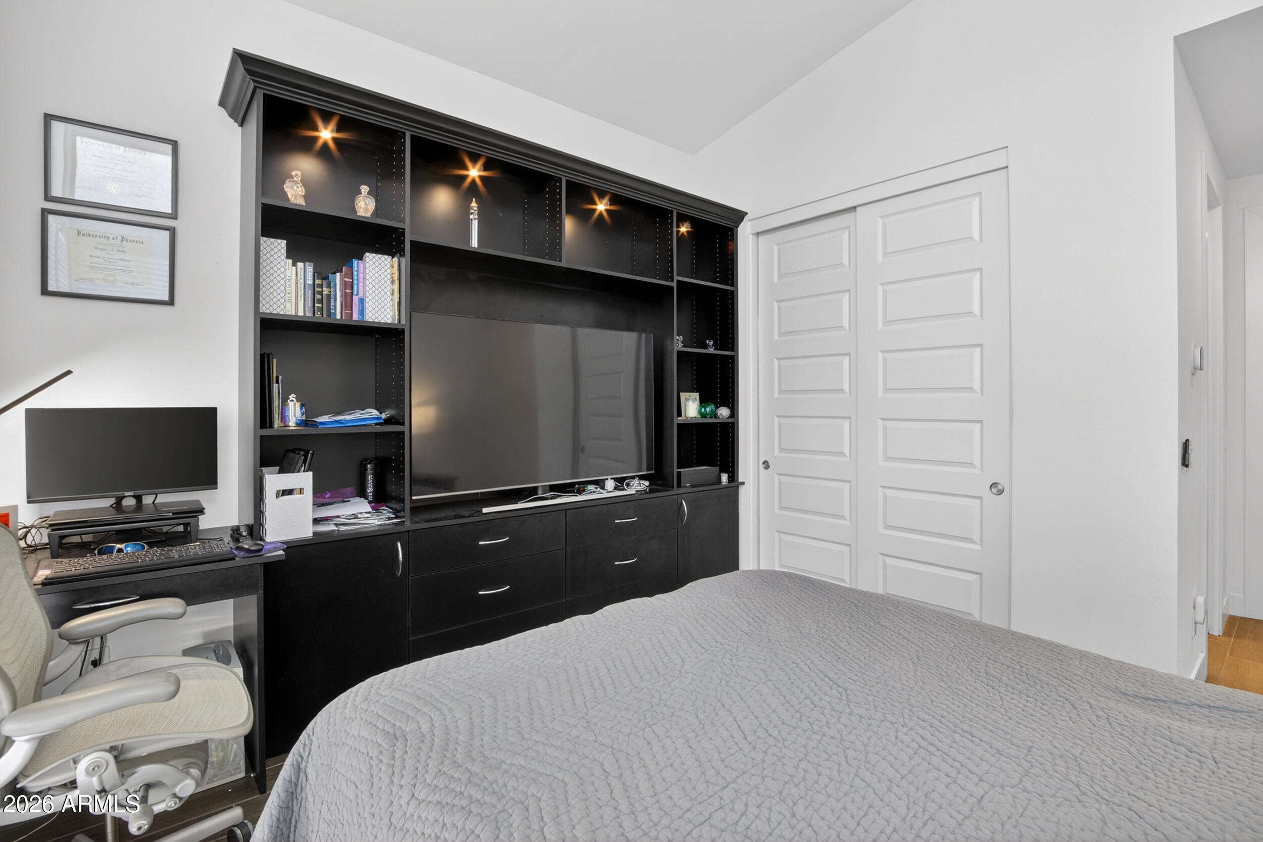 939 East Paseo Way Phoenix, AZ 85042 - Photo 51 of 78 a bedroom with a bed and a flat screen tv