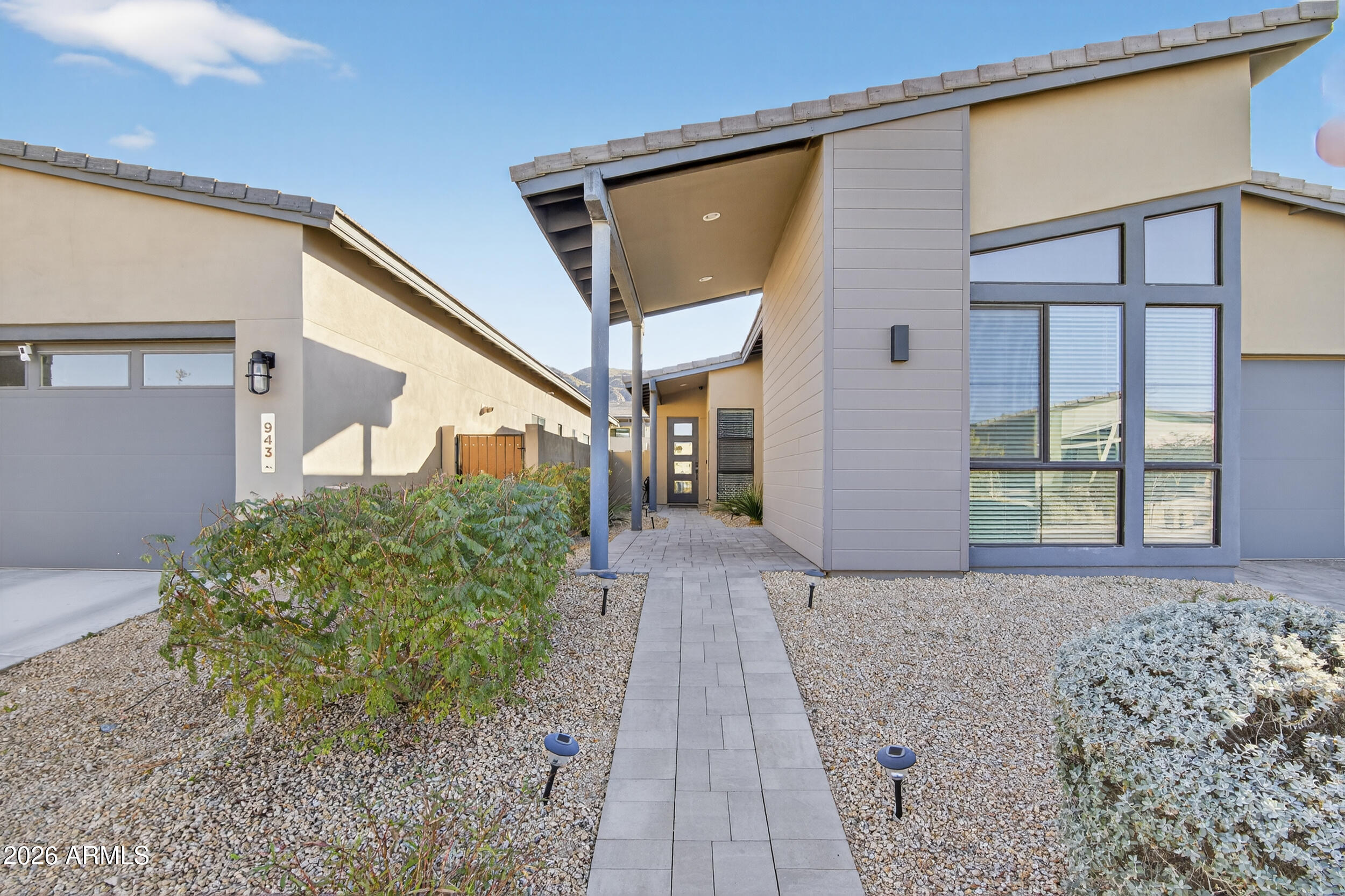 939 East Paseo Way Phoenix, AZ 85042 - Photo 4 of 78 a front view of a house with garden