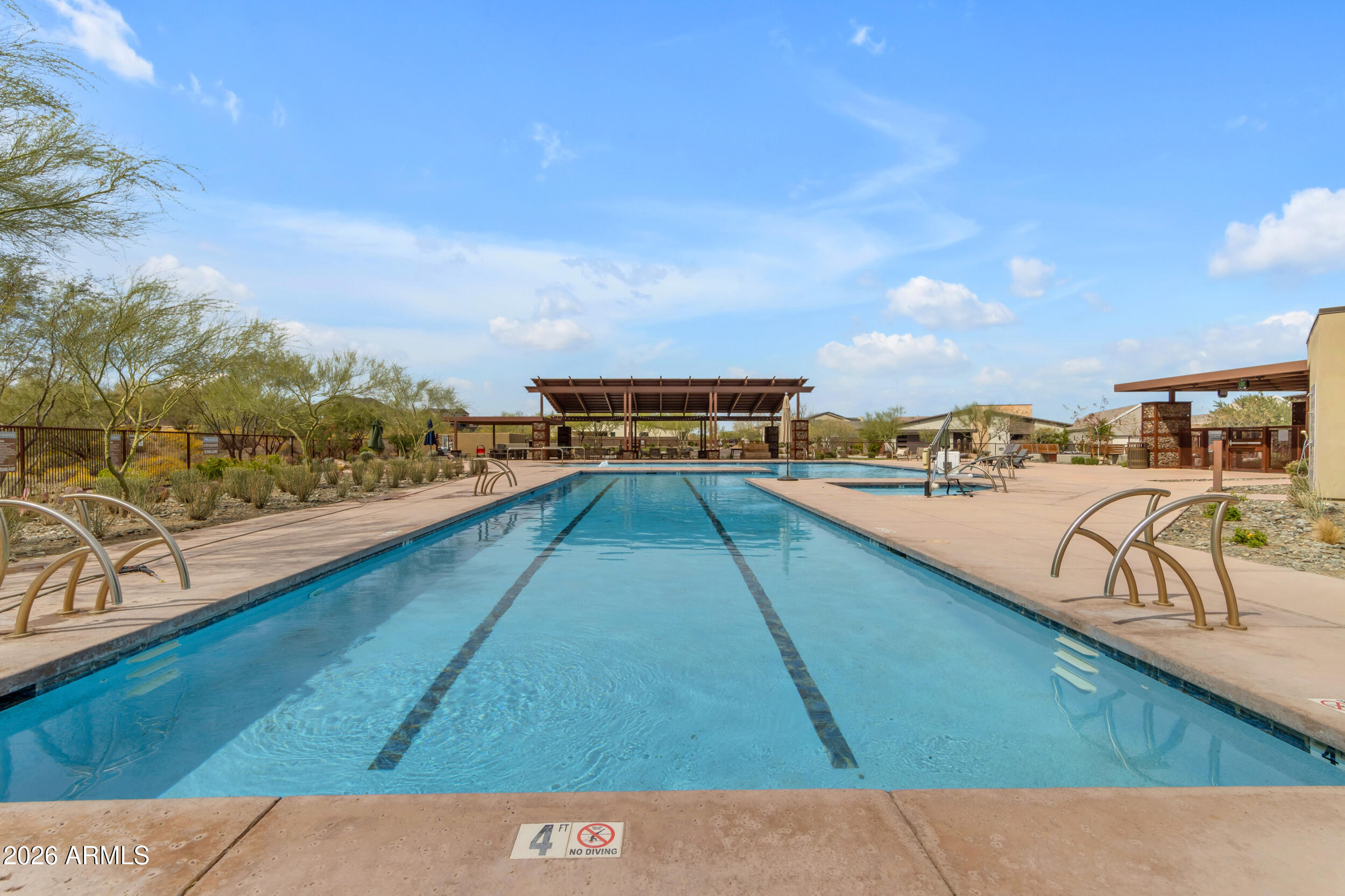 939 East Paseo Way Phoenix, AZ 85042 - Photo 70 of 78 a view of swimming pool with a table and chairs