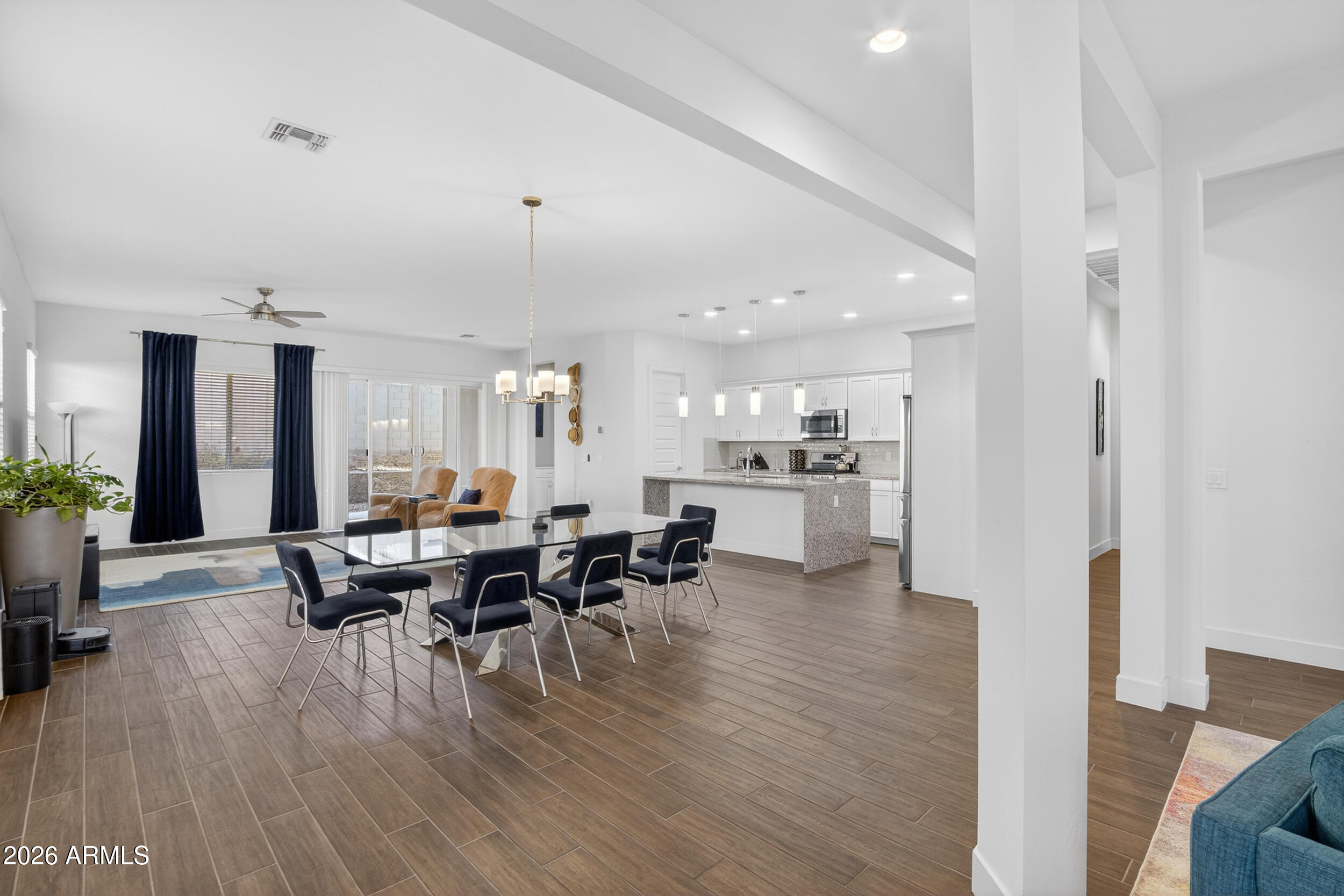 939 East Paseo Way Phoenix, AZ 85042 - Photo 7 of 78 a view of a dining room with furniture and wooden floor